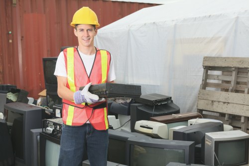 Overflowing commercial bin beside a business premises